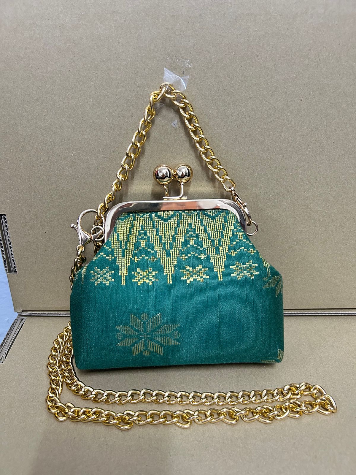 a purse with a chain attached to it