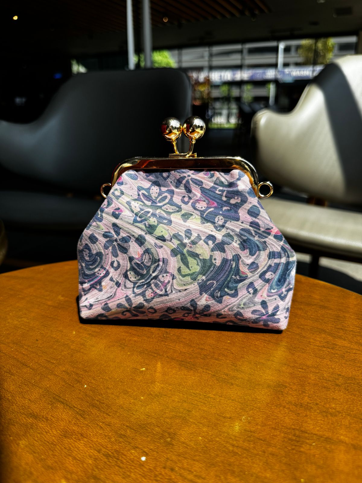 a purse sitting on top of a wooden table