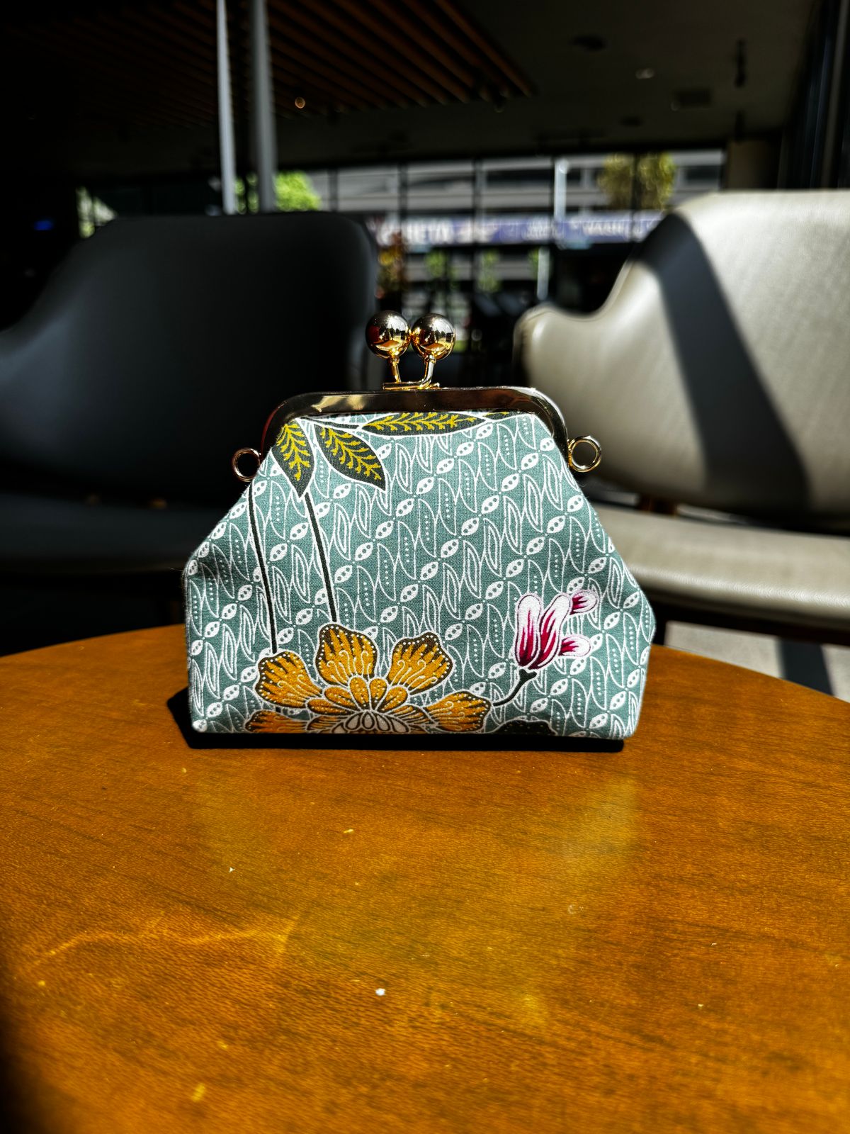 a purse sitting on top of a wooden table