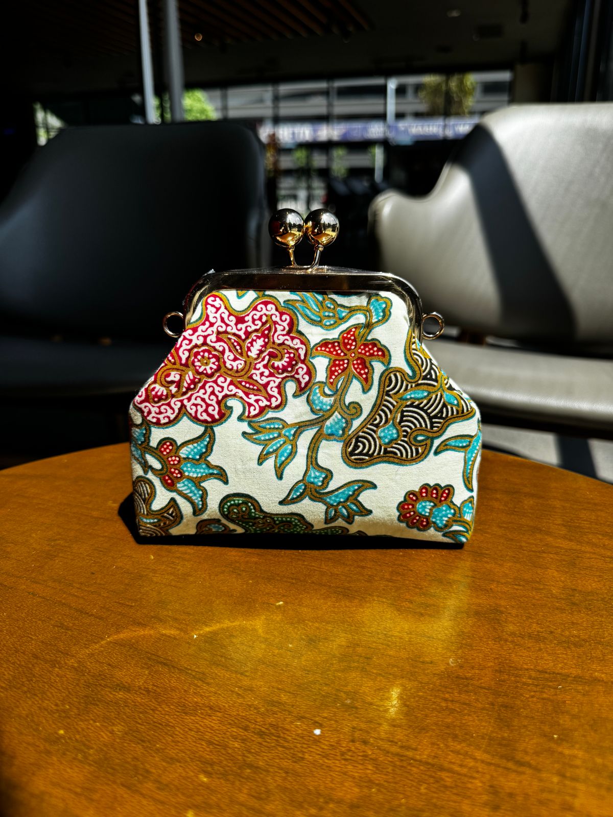 a purse sitting on top of a wooden table