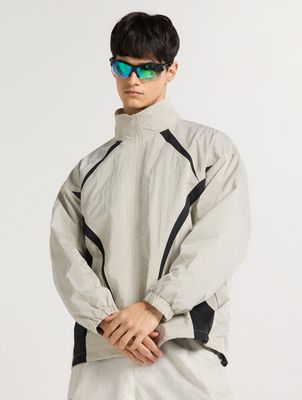 a man wearing a white jacket and sunglasses