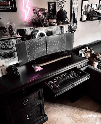 a computer desk with a keyboard and mouse