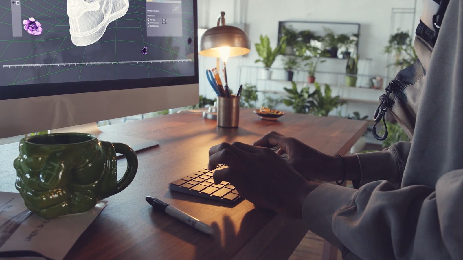 a person sitting at a desk using a computer