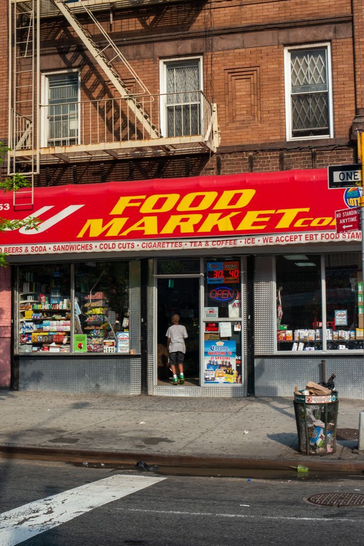 a food market on the corner of a city street