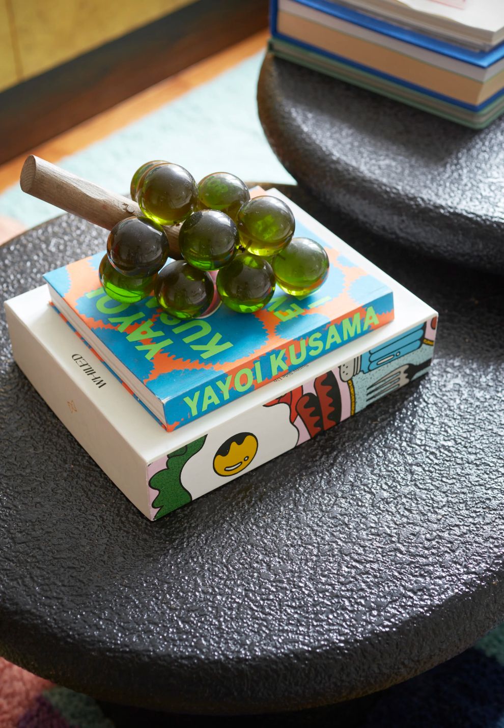 a stack of books sitting on top of a table