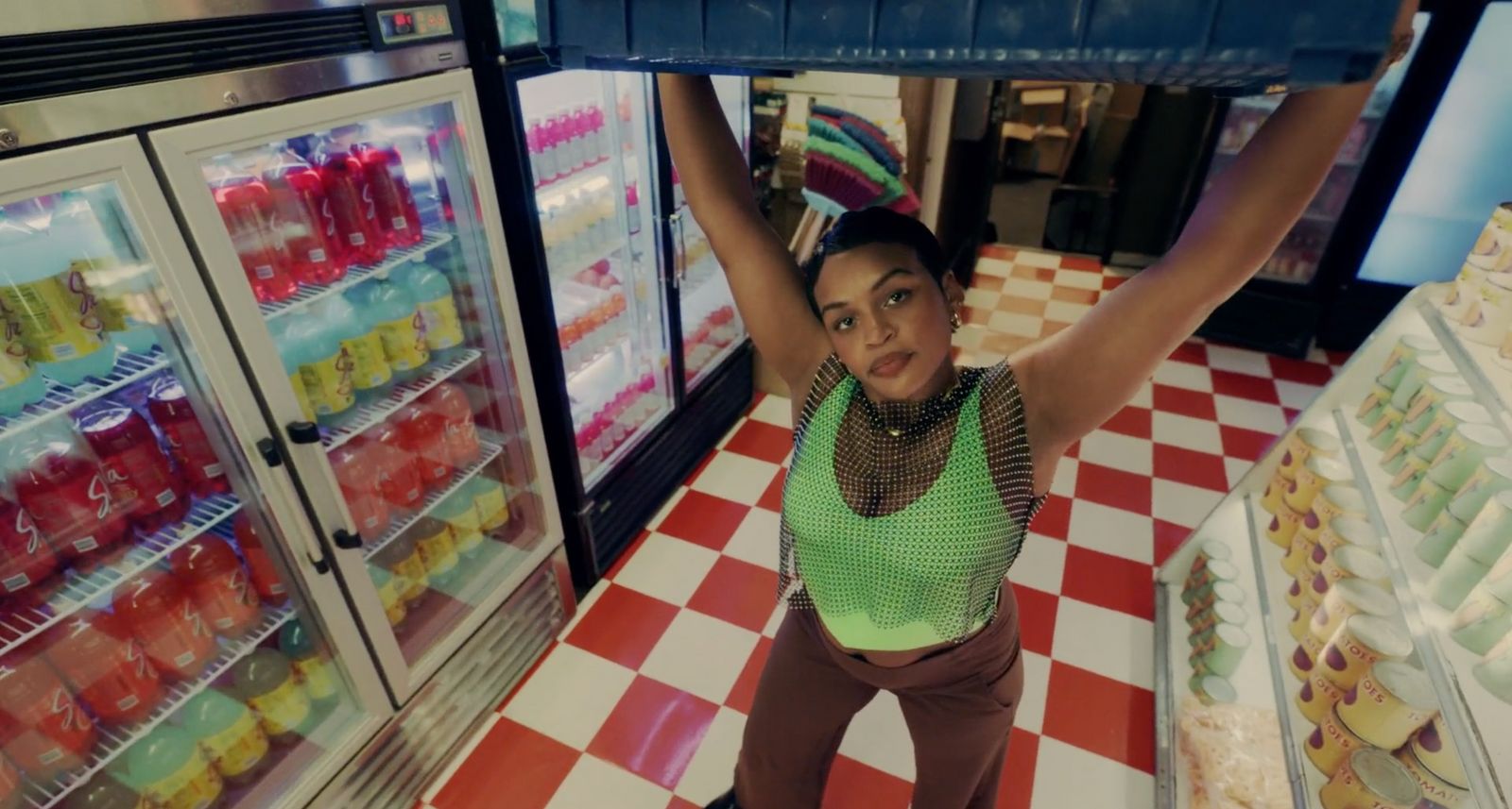 a woman is holding up a shelf in a store