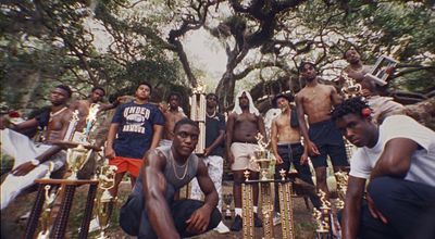 a group of young men standing around each other