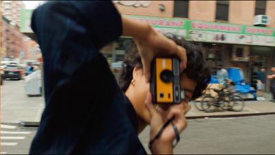 a man holding a camera up to his face