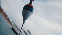 a red, white and blue object hanging from a hook