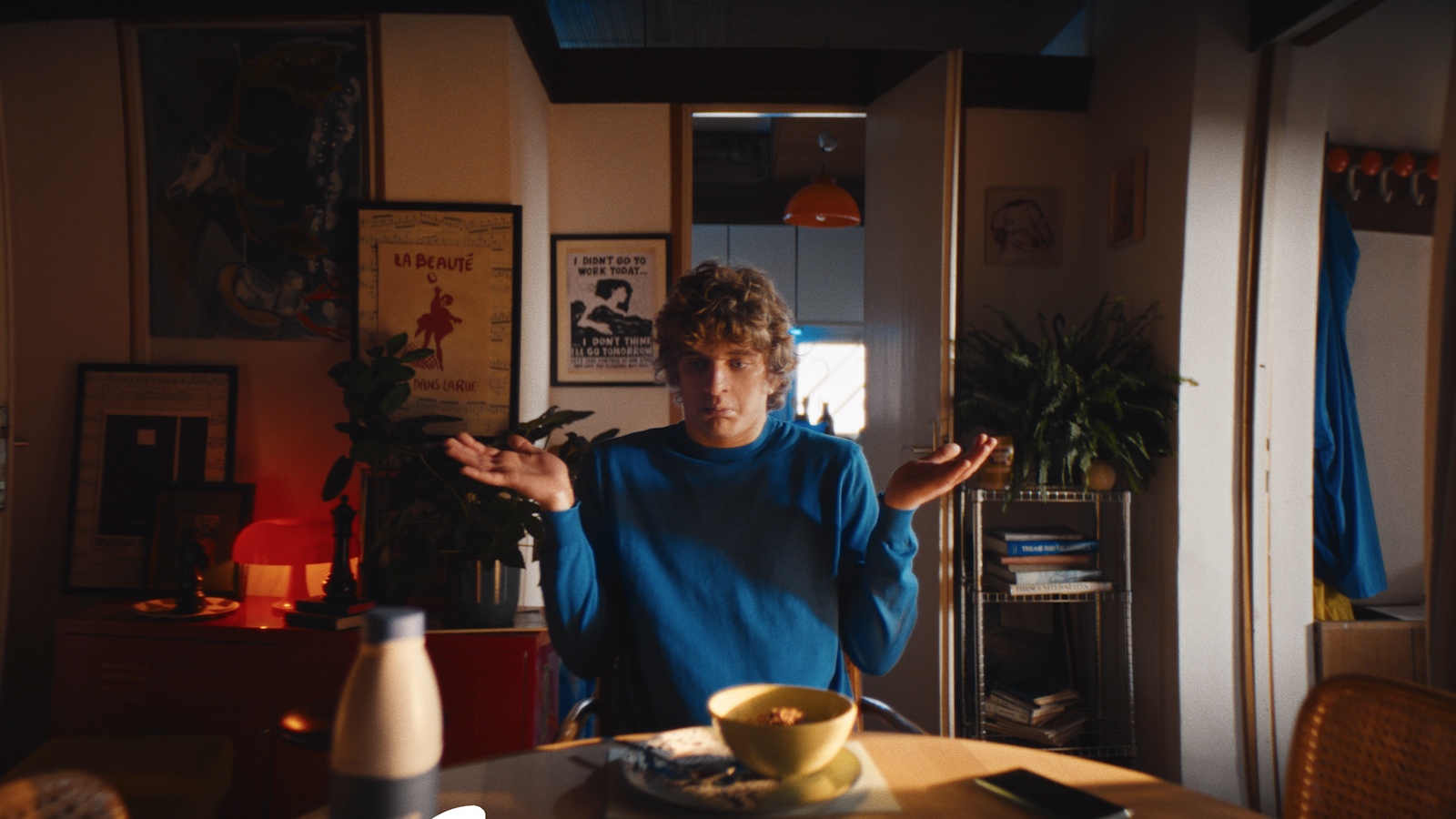 a man standing in front of a table in a room