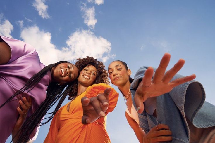 a group of young women standing next to each other