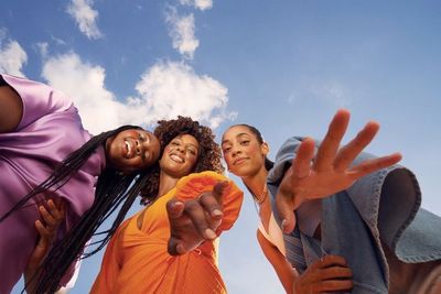 a group of young women standing next to each other