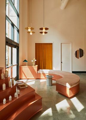 a large room with a circular bench in the middle of it