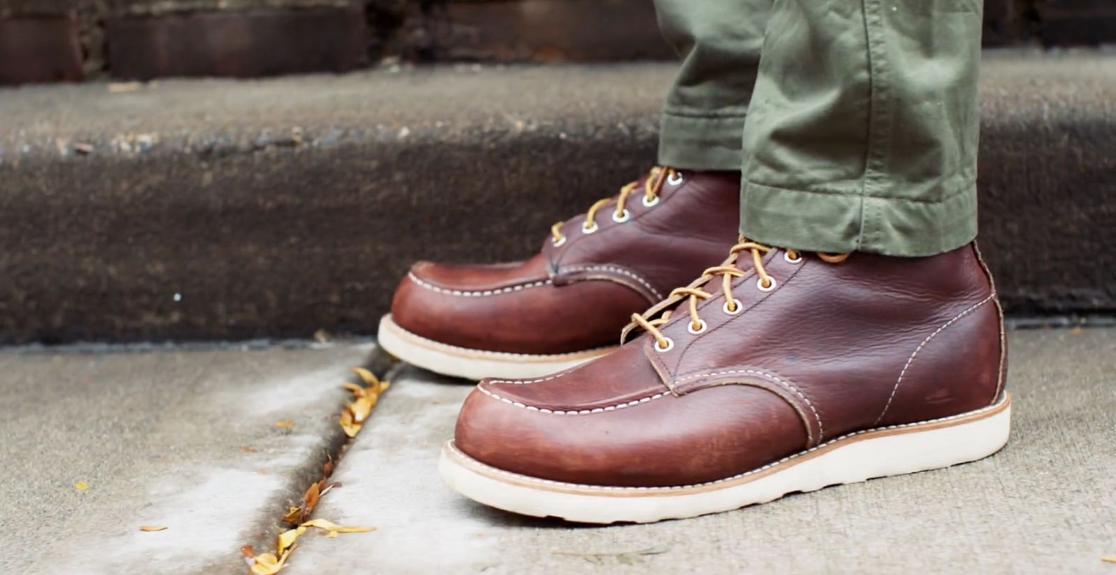 a close up of a person wearing brown shoes