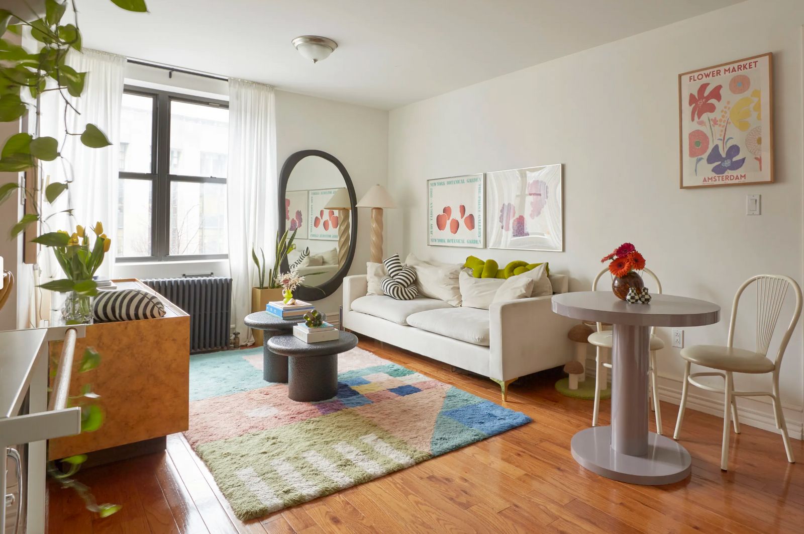 a living room filled with furniture and a mirror