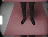 a person standing on a pink and white floor