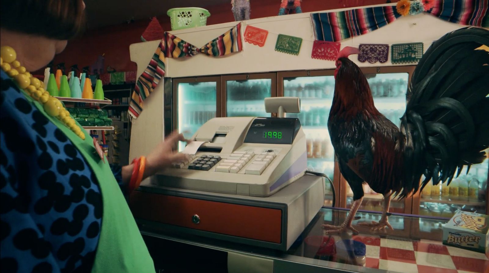 a woman standing in front of a cash register machine