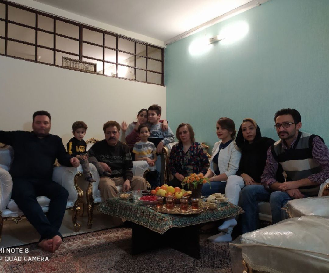 a group of people sitting around a coffee table