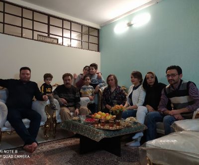 a group of people sitting around a coffee table