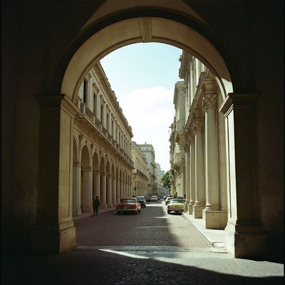 a street with cars parked on both sides of it