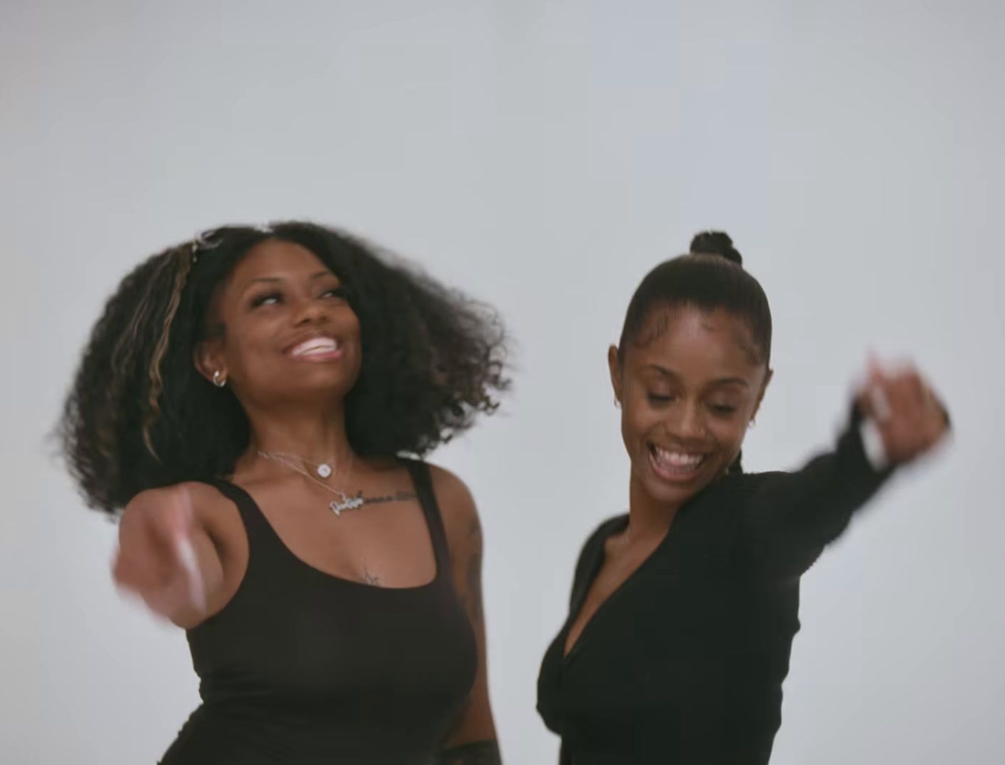 a couple of women standing next to each other