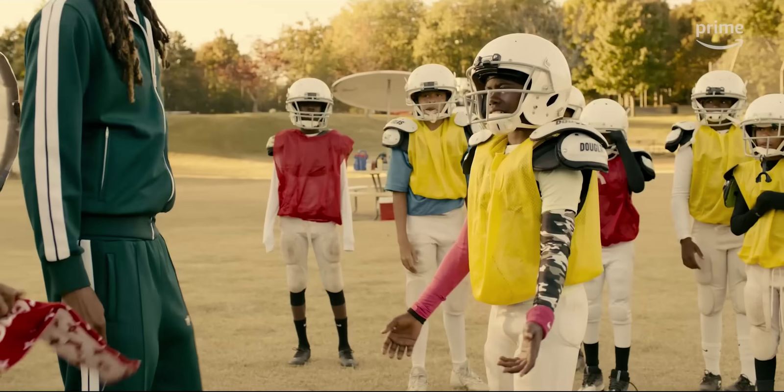 a group of young football players standing next to each other