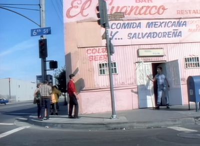 a group of people standing outside of a building