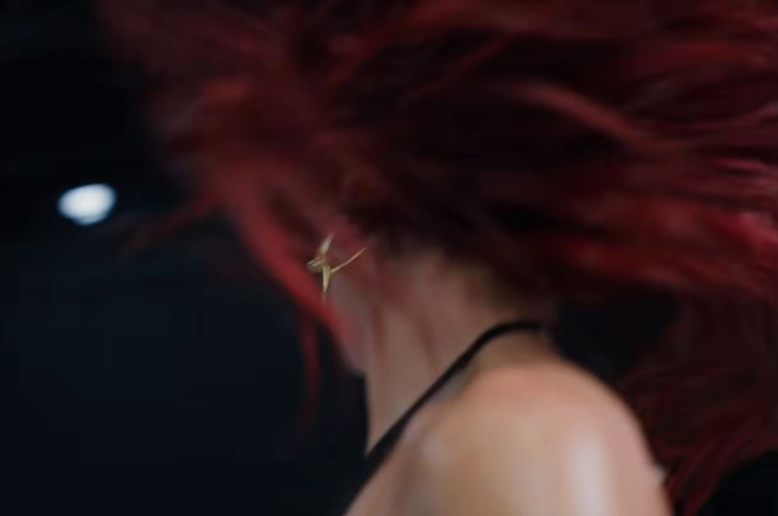 a close up of a woman with red hair