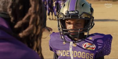 a close up of a person wearing a football uniform