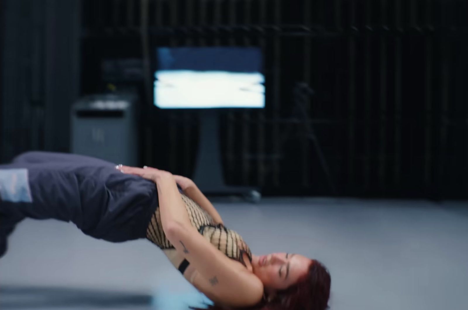 a woman doing a handstand on her stomach