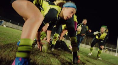 a group of young people playing a game of soccer