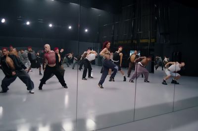 a group of people dancing in a large room