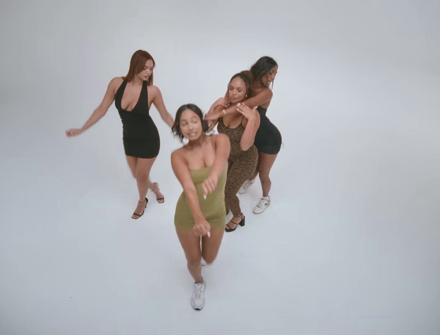 a group of young women standing next to each other