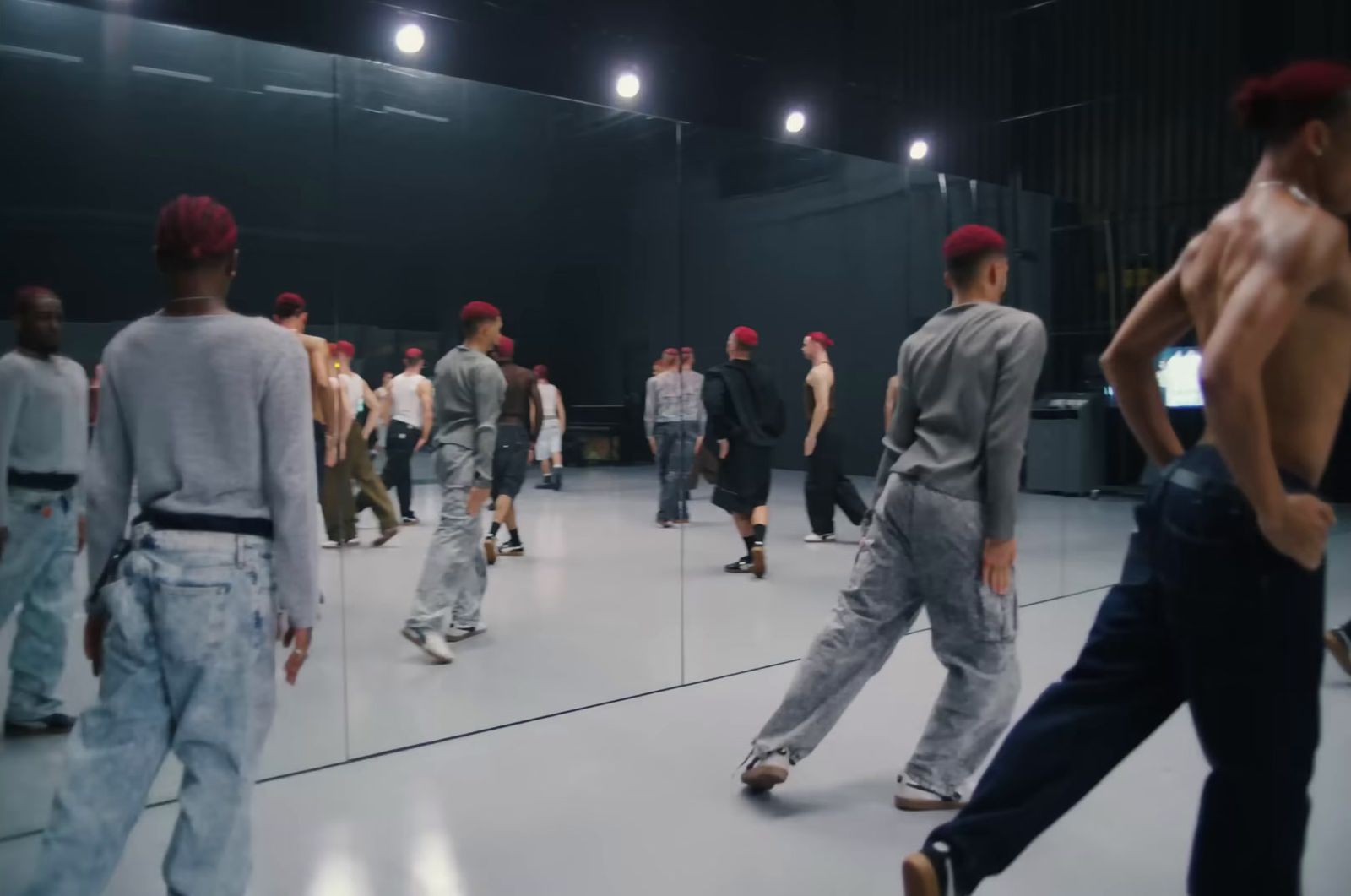 a group of men walking down a runway