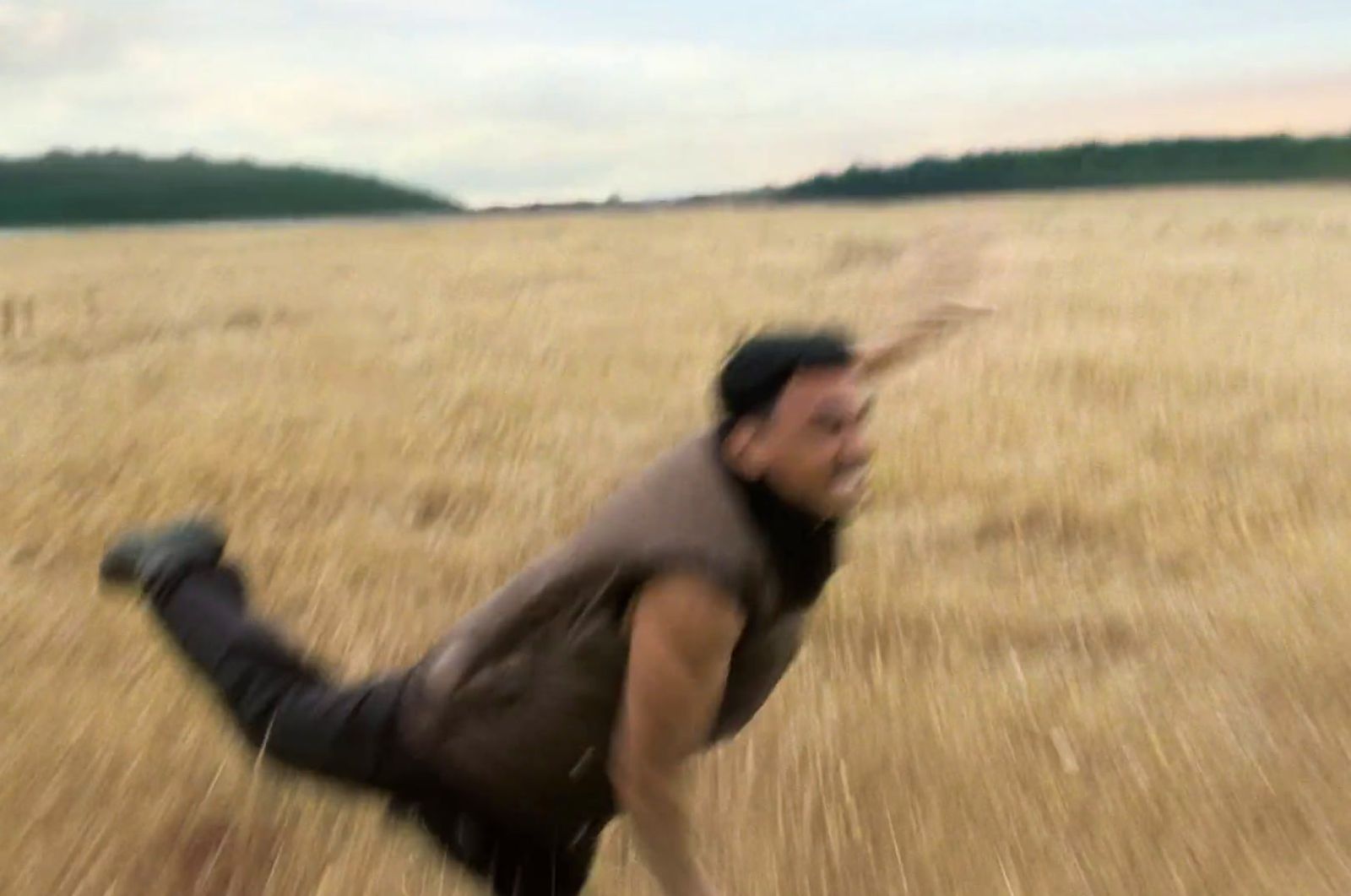 a blurry photo of a man running through a field