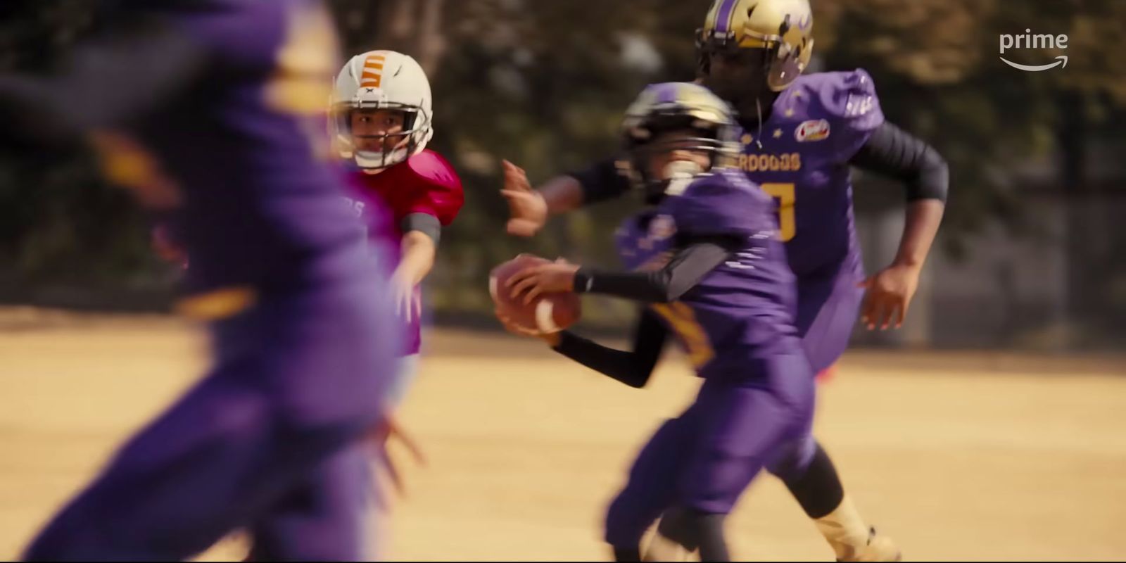 a group of young men playing a game of football