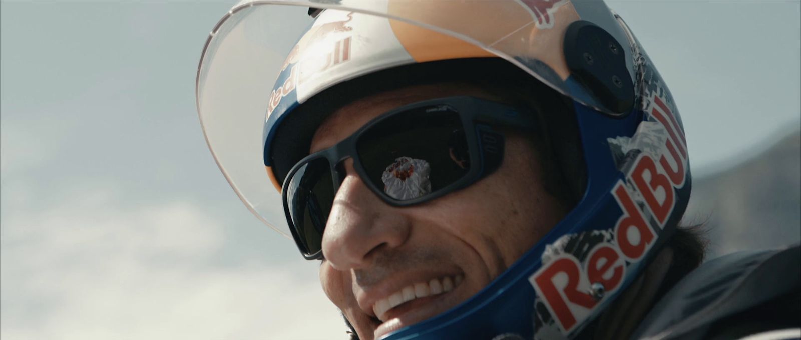 a close up of a person wearing a helmet and goggles