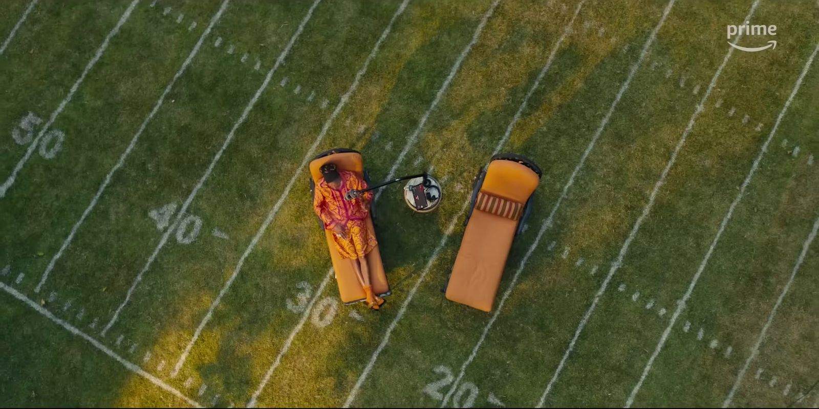 an aerial view of a football field with an inflatable chair and a football