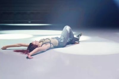 a woman laying on the ground in a show