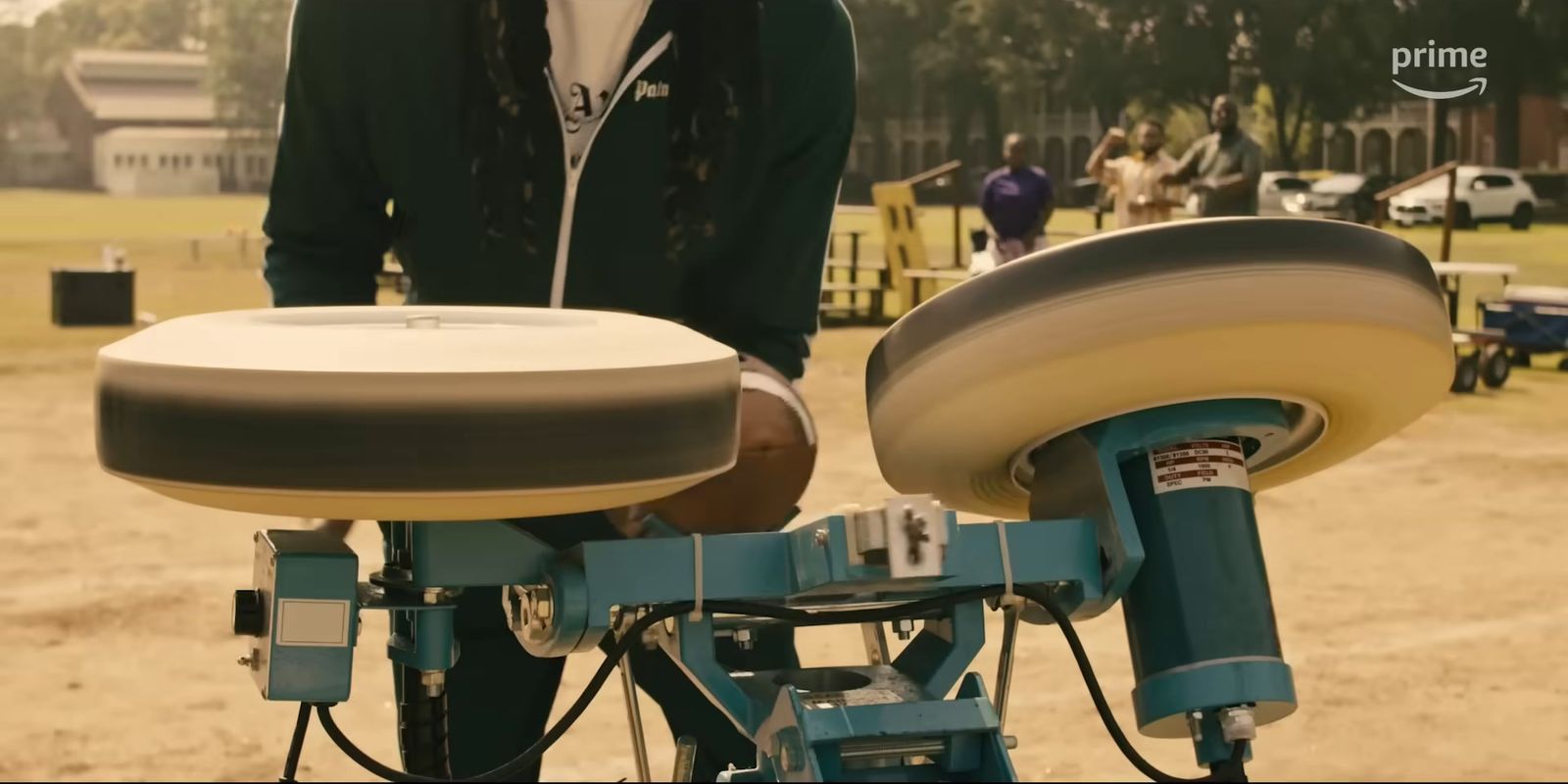 a person standing next to a bike with a seat on it