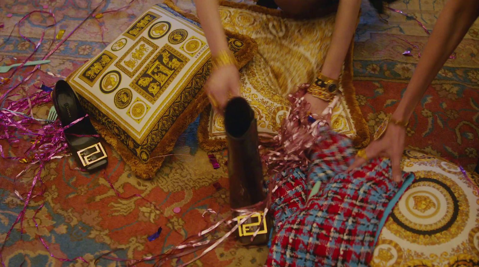 a person cutting a cake with a knife