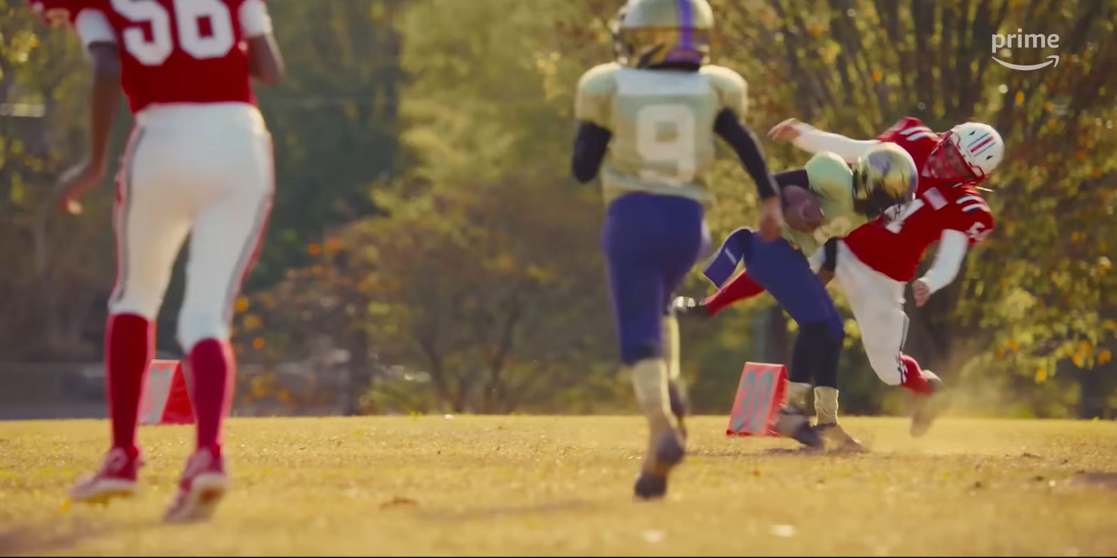 a group of people playing a game of football