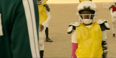 a group of young children wearing football uniforms