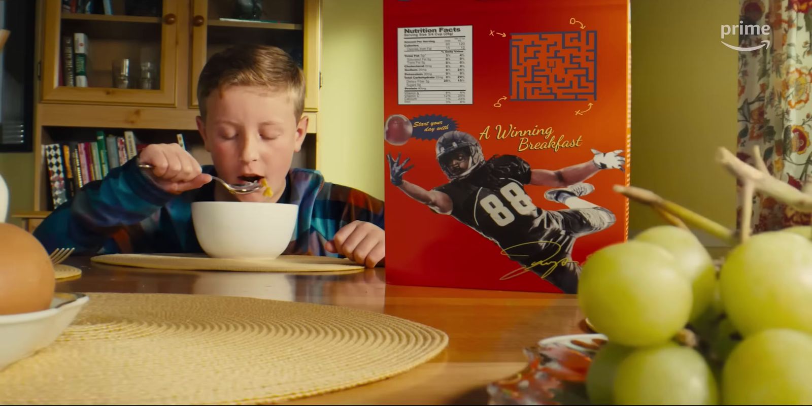 a young boy eating cereal from a bowl