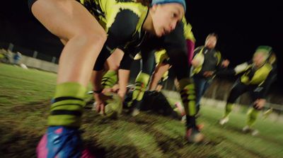 a group of young people playing a game of soccer