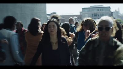 a group of people walking down a street