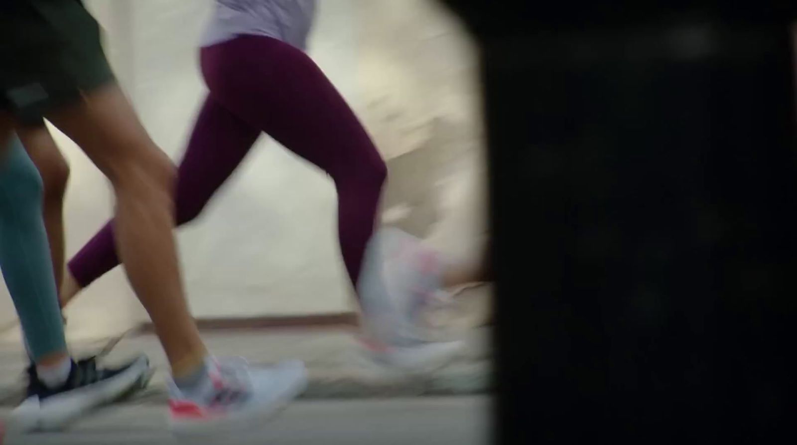 a group of people running on a street