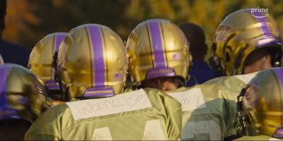 a group of football players standing next to each other