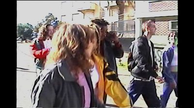 a group of people walking down a street