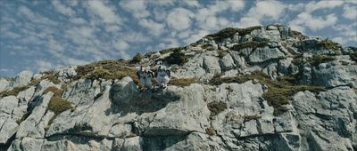 a group of people standing on top of a mountain